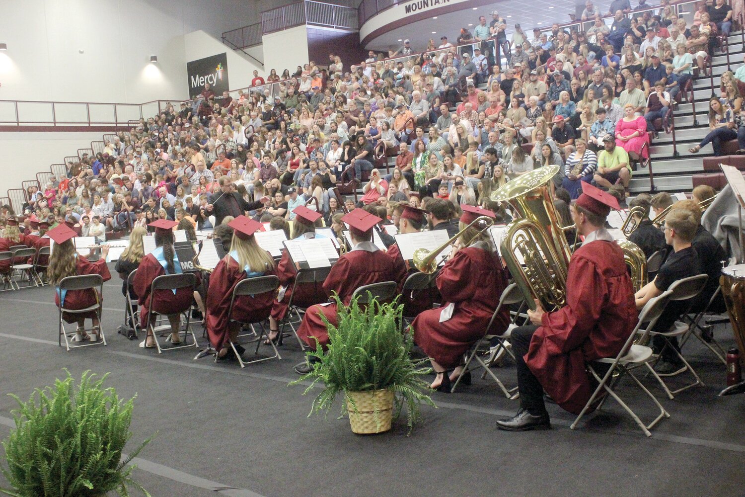 Graduates join the band for a performance at graduation.